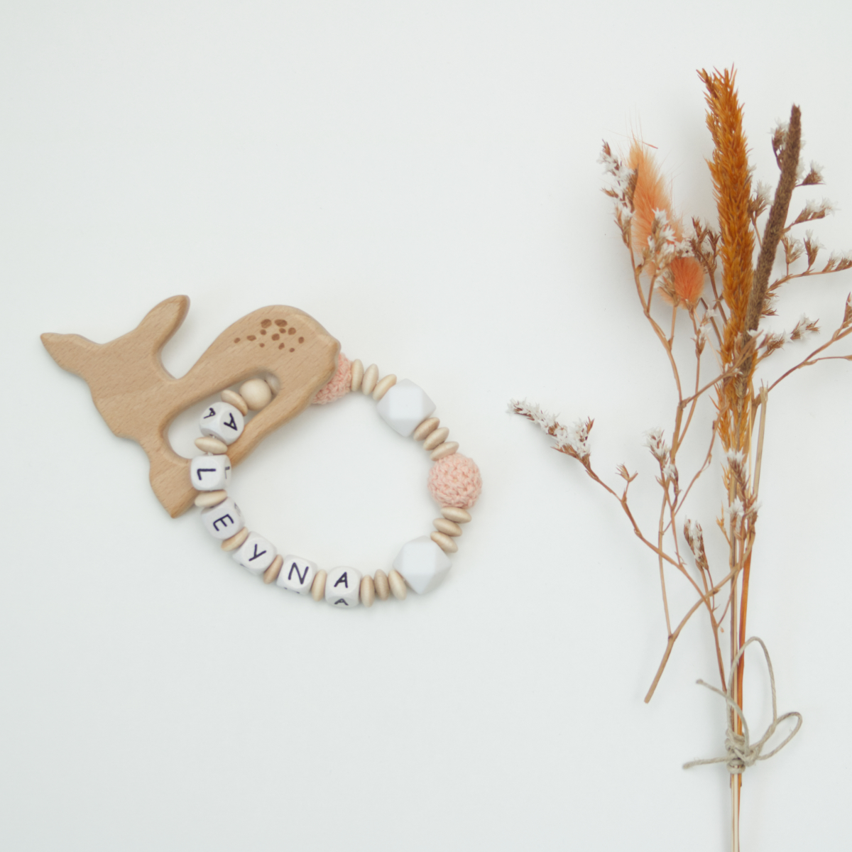 baby rattle, wooden teether, beads, monochrome beige, dried bouquet