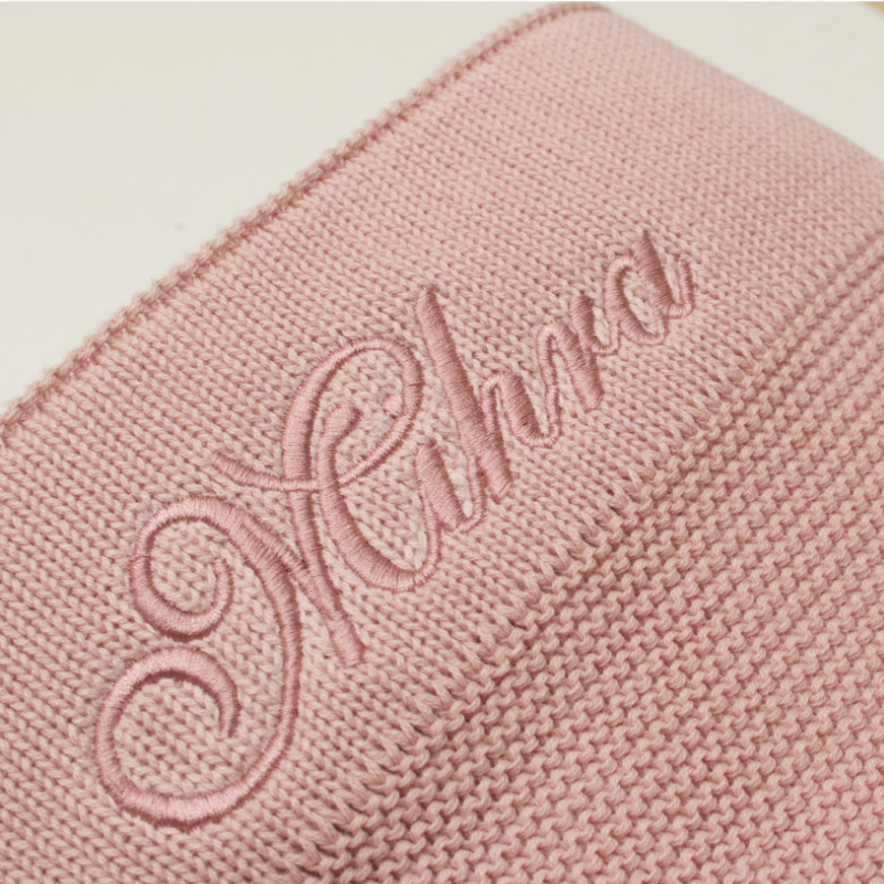Wollschal, gestrickter Schal, rosa Schal, Stickerei, Gewebe-Struktur